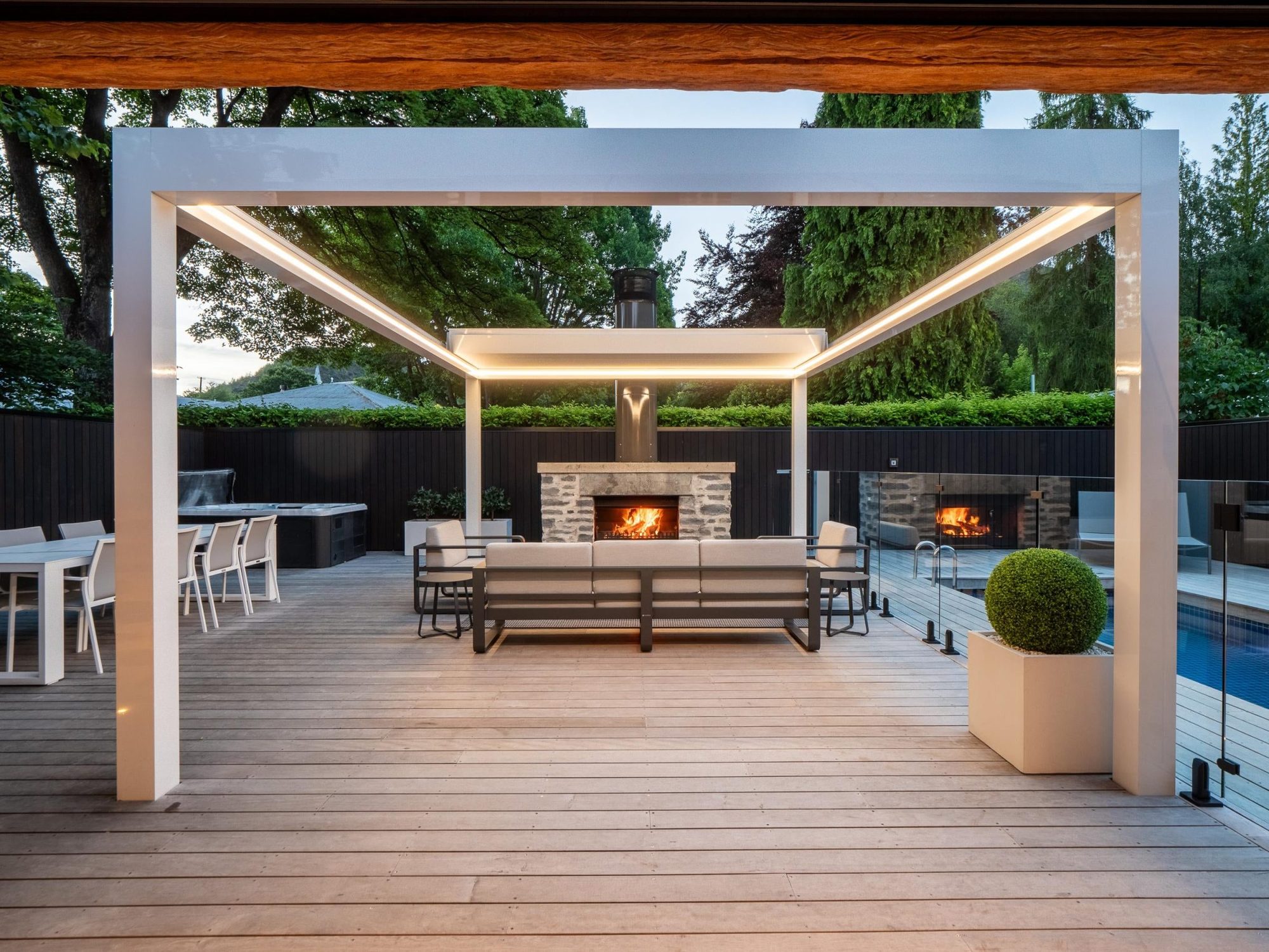 Covered outdoor living with schist fireplace
