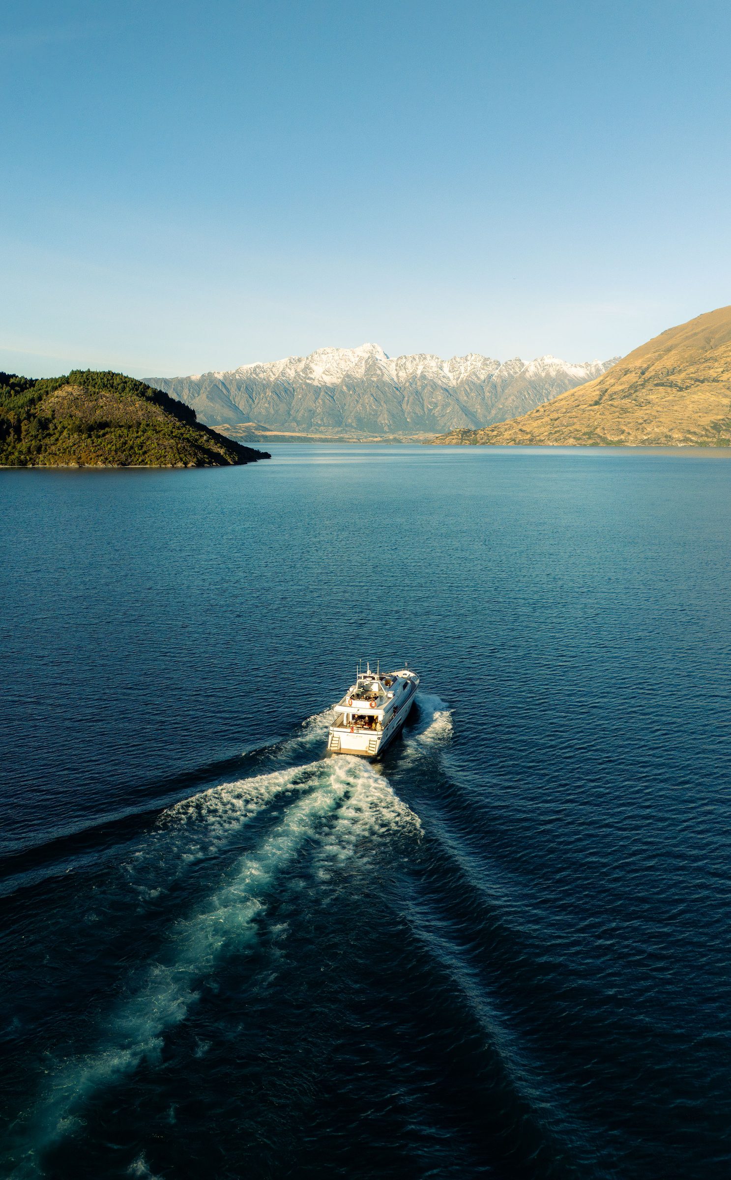 Pacific Jemm cruising into Lake Wakatipu, mountains in the distance